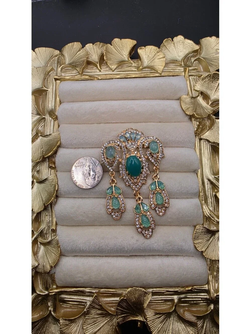 Vintage-Inspired Teal Gemstone Brooch with Dangling Design